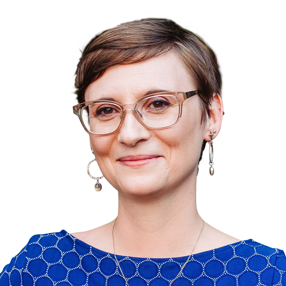 Portrait of Amanda Meeks, short brown hair with glasses and a bright blue dress